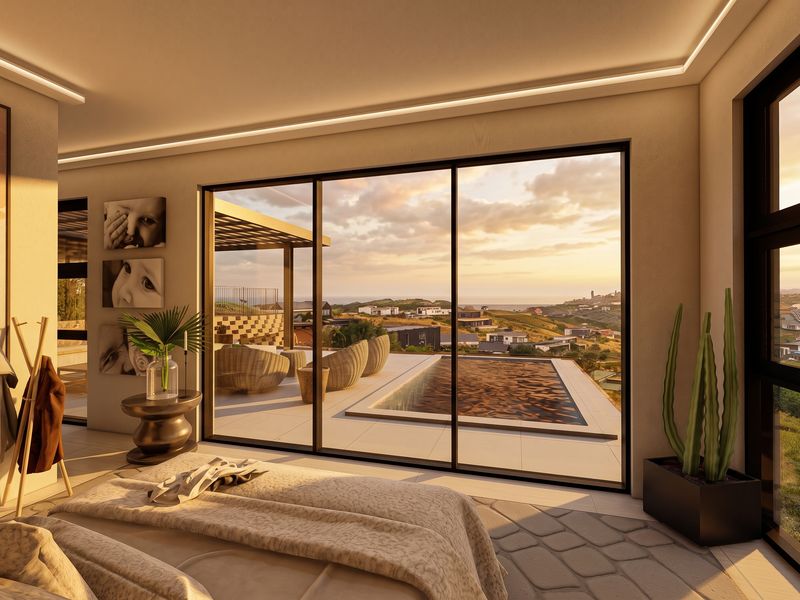 Modern bedroom featuring large sliding glass doors that open onto a private patio with a pool and scenic coastal views.