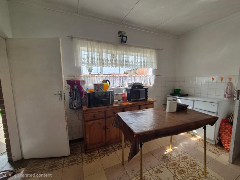 A dated kitchen featuring tiled flooring and a tiled backsplash, offering a functional layout ready for modern renovation and aesthetic updates.
