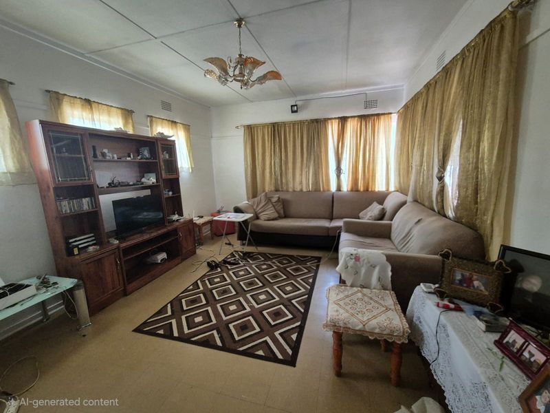A living room featuring tiled flooring and ceiling panels, offering a functional space with potential for modernization and aesthetic updates.