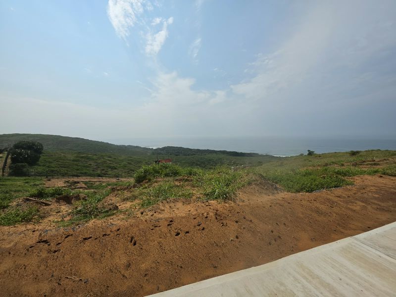 A scenic view of the coastal landscape and ocean from the vacant residential property.