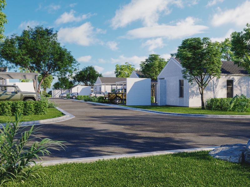 A view of a modern residential street featuring paved roads, landscaped verges, and contemporary housing units with integrated carports.