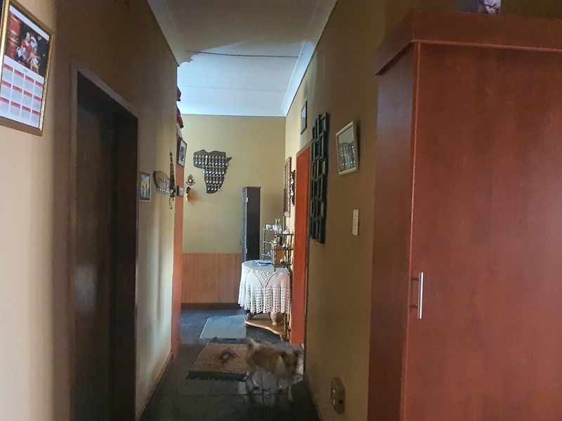 A functional interior hallway connecting various rooms, featuring standard internal doors and neutral wall finishes.