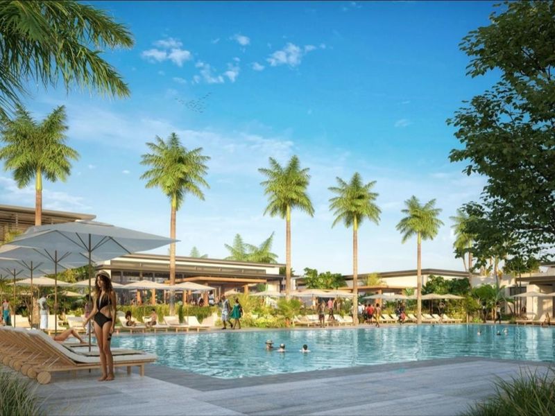 A professionally rendered view of a luxury swimming pool area featuring a spacious paved deck and mature palm tree landscaping.