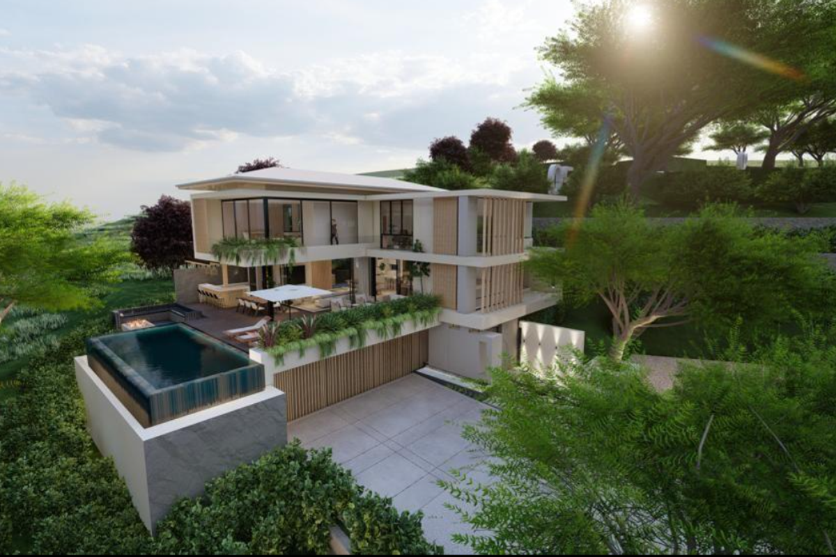 A modern architectural residence featuring a raised swimming pool, expansive timber decking, built-in fire pit, and large glass facades set within a landscaped hillside.