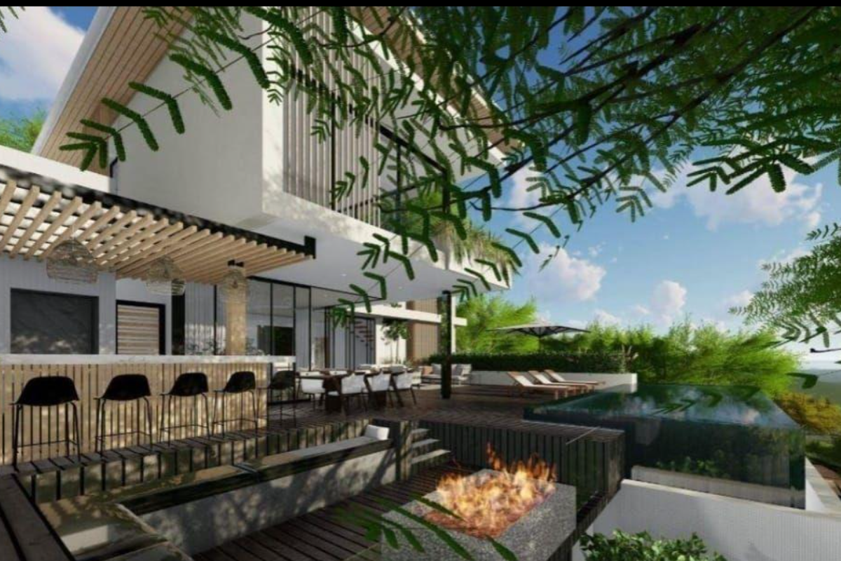 Modern outdoor entertainment area featuring an infinity pool, timber decking, a built-in fire pit, and a covered bar area.