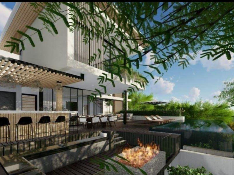 Modern outdoor entertainment area featuring an infinity pool, timber decking, a built-in fire pit, and a covered bar area.