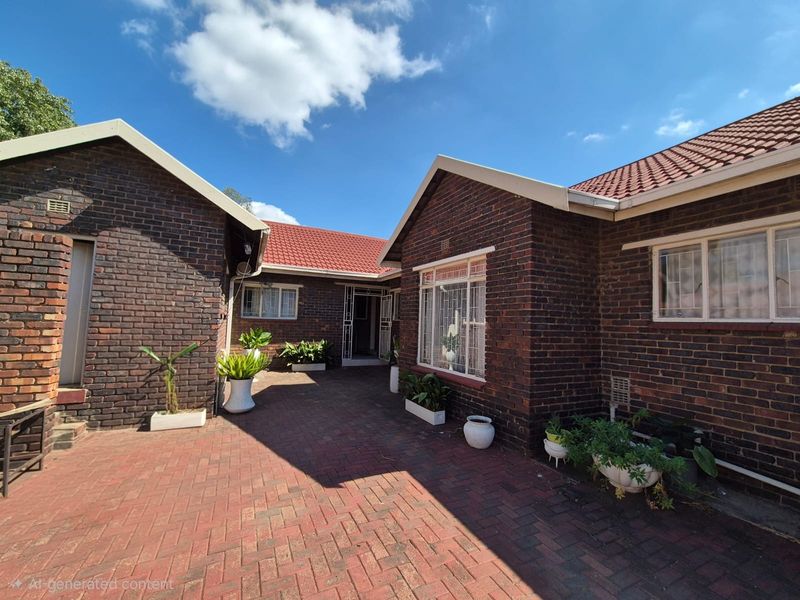 A well-maintained rear courtyard featuring classic face brick construction, a tiled roof, and paved flooring, providing a private outdoor space.