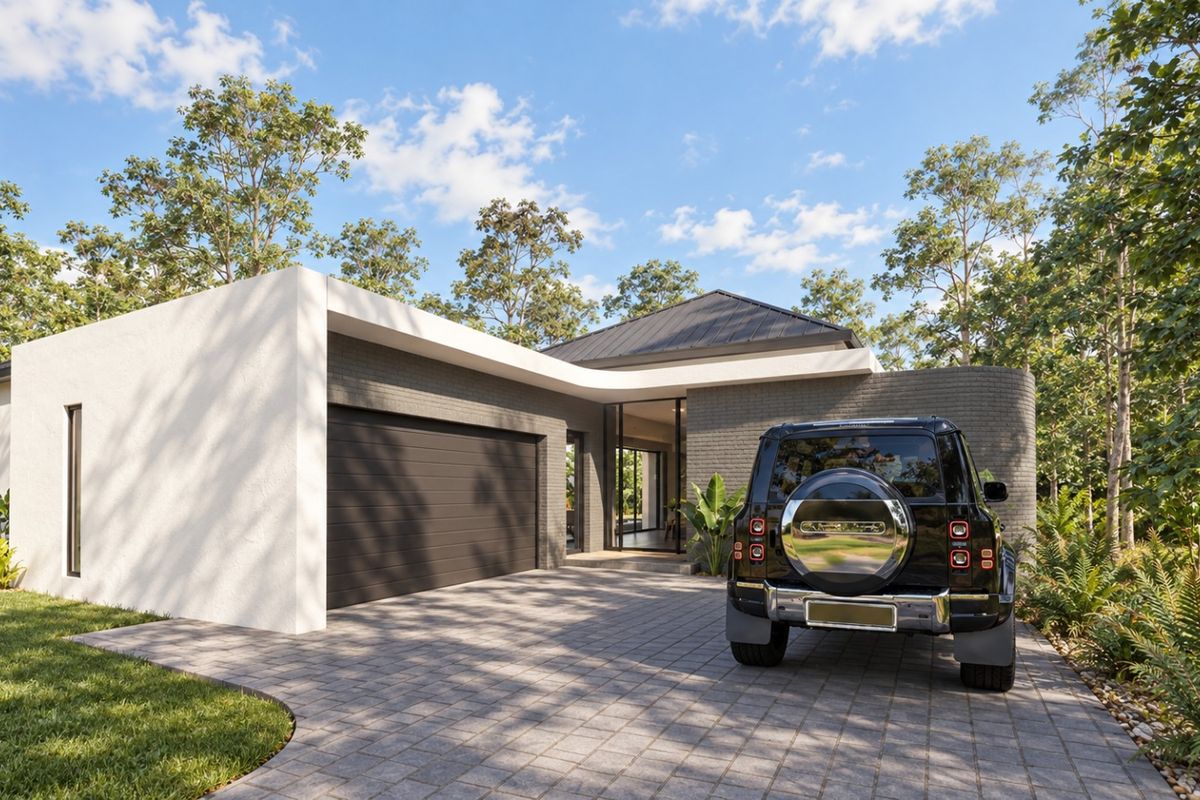 Modern single-story residence featuring a contemporary brick facade, paved driveway, and integrated double garage set within a lush, landscaped environment.