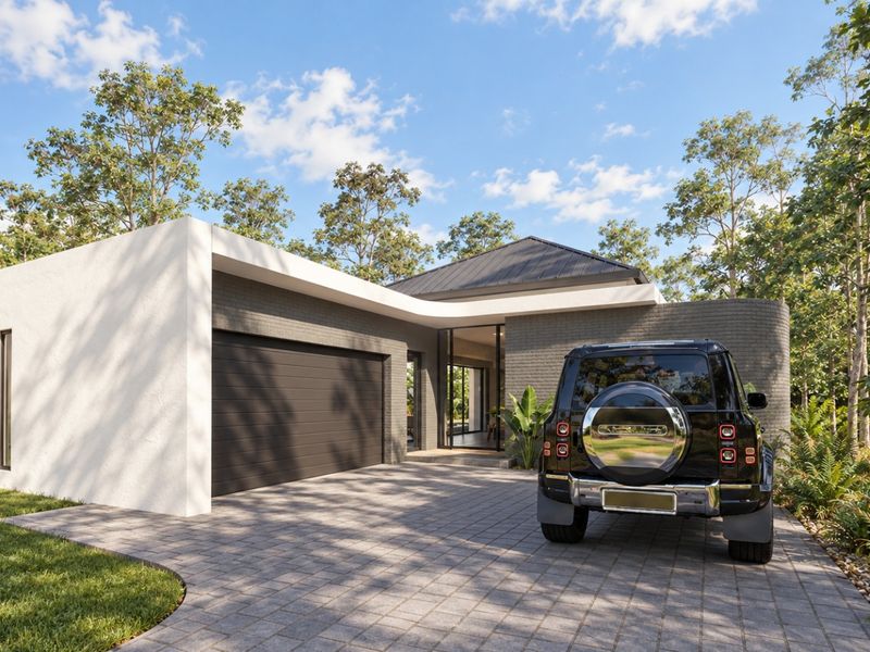 Modern single-story residence featuring a contemporary brick facade, paved driveway, and integrated double garage set within a lush, landscaped environment.