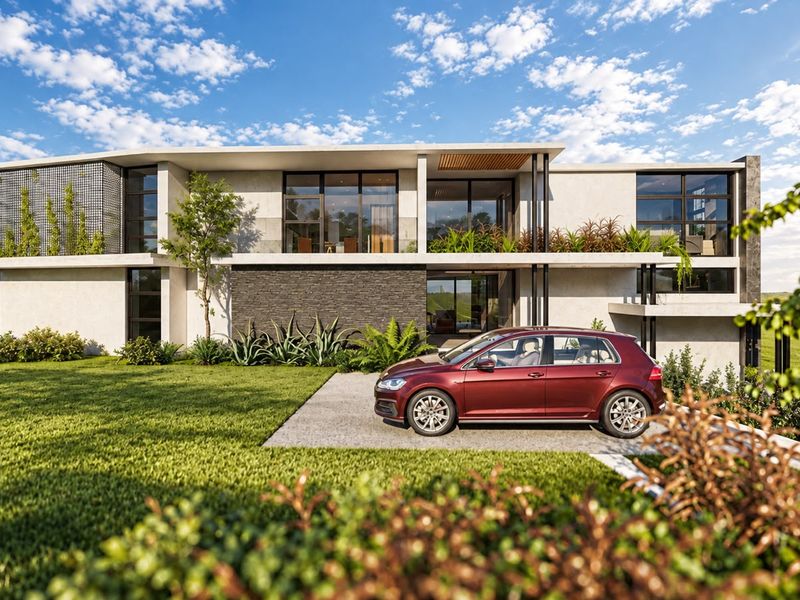 Modern two-story residential property featuring stone cladding, expansive glass windows, a private balcony, and a well-maintained landscaped front garden.