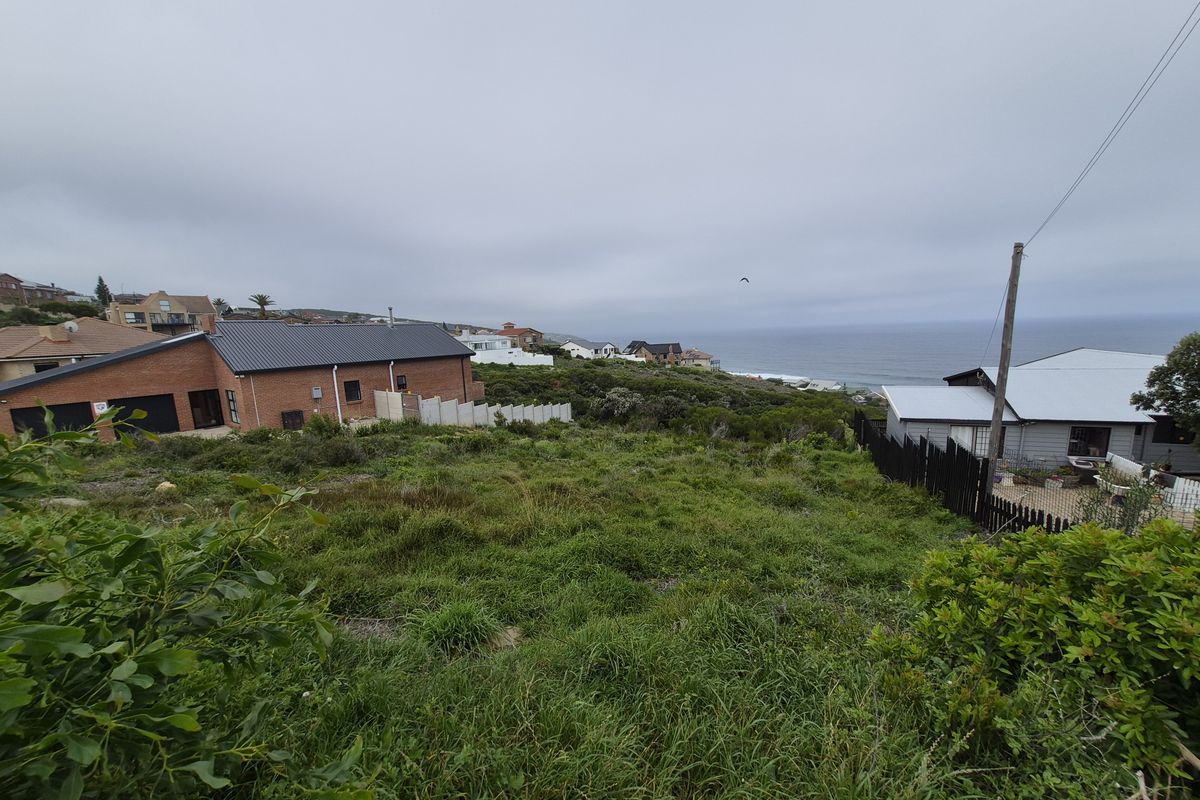 A view of the coastal residential area and ocean horizon from the vacant land plot.