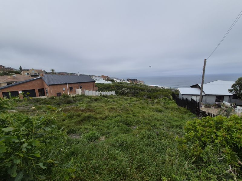A view of the coastal residential area and ocean horizon from the vacant land plot.