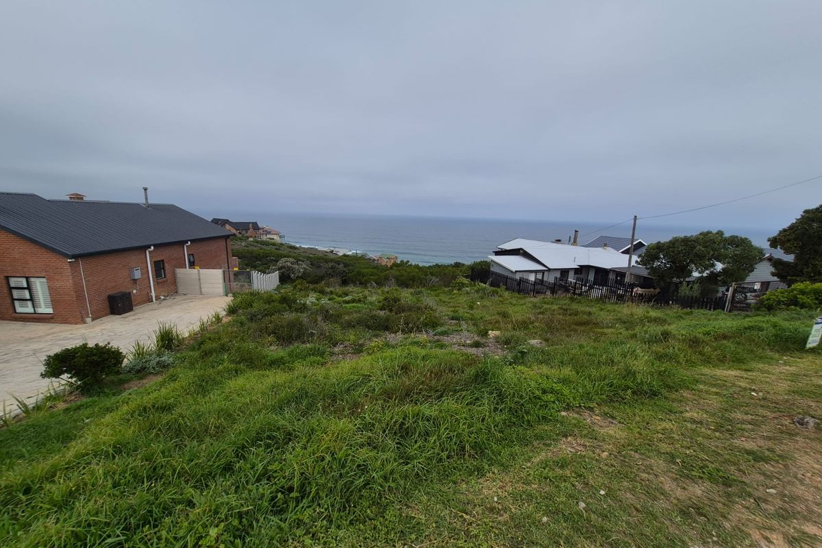 A view of the coastal landscape and surrounding residential properties from the vacant residential land.