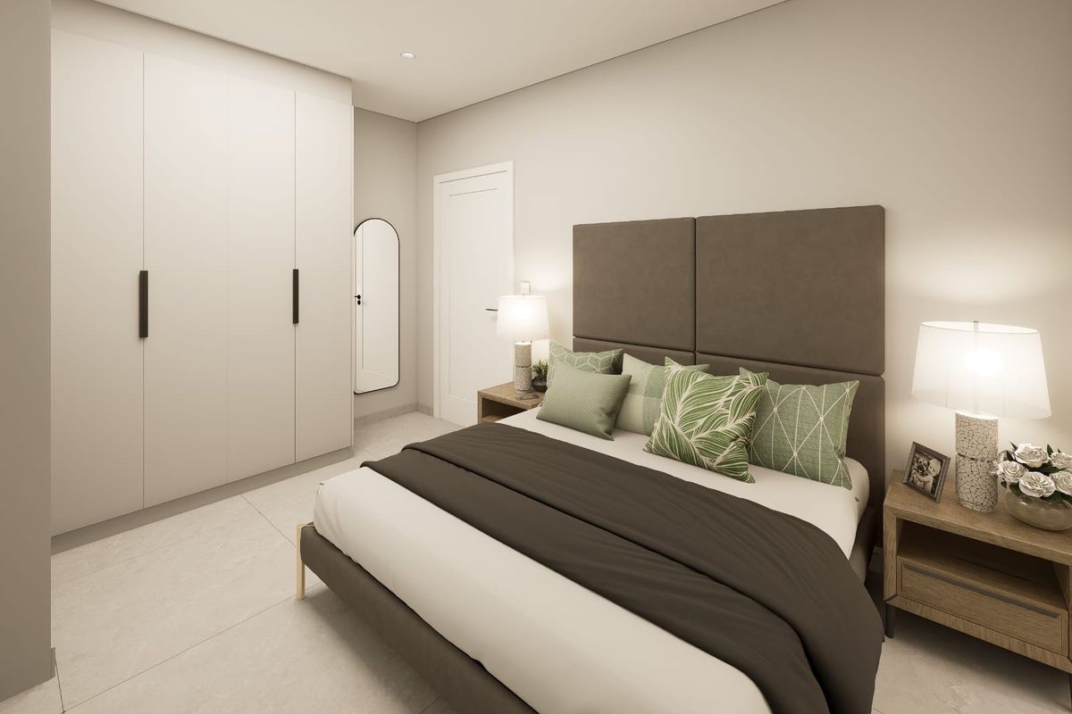 A modern, well-lit bedroom featuring neutral tones, tiled flooring, and ample built-in wardrobe storage.