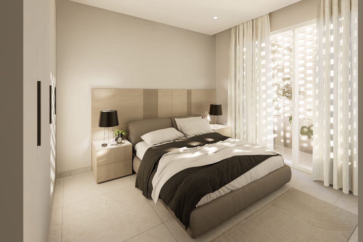 A modern, well-lit bedroom featuring built-in wardrobes, tiled flooring, and a sliding glass door leading to an outdoor space.