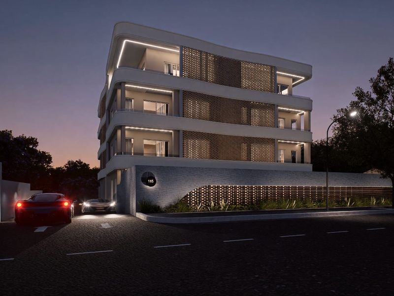 A modern apartment building exterior at dusk, featuring contemporary architectural design, decorative brickwork, and integrated facade lighting.