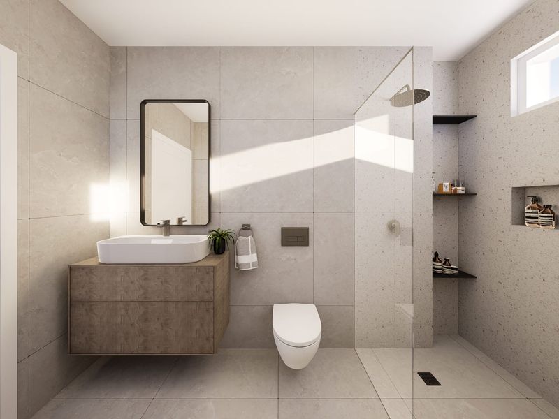 Modern bathroom featuring a wall-mounted vanity, vessel sink, wall-hung toilet, and a spacious walk-in shower with a glass screen and recessed niche.