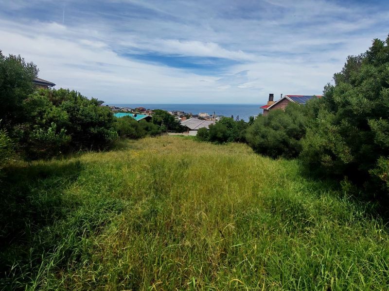 A view of the coastal landscape from the vacant residential land, showcasing the surrounding neighborhood and ocean horizon.