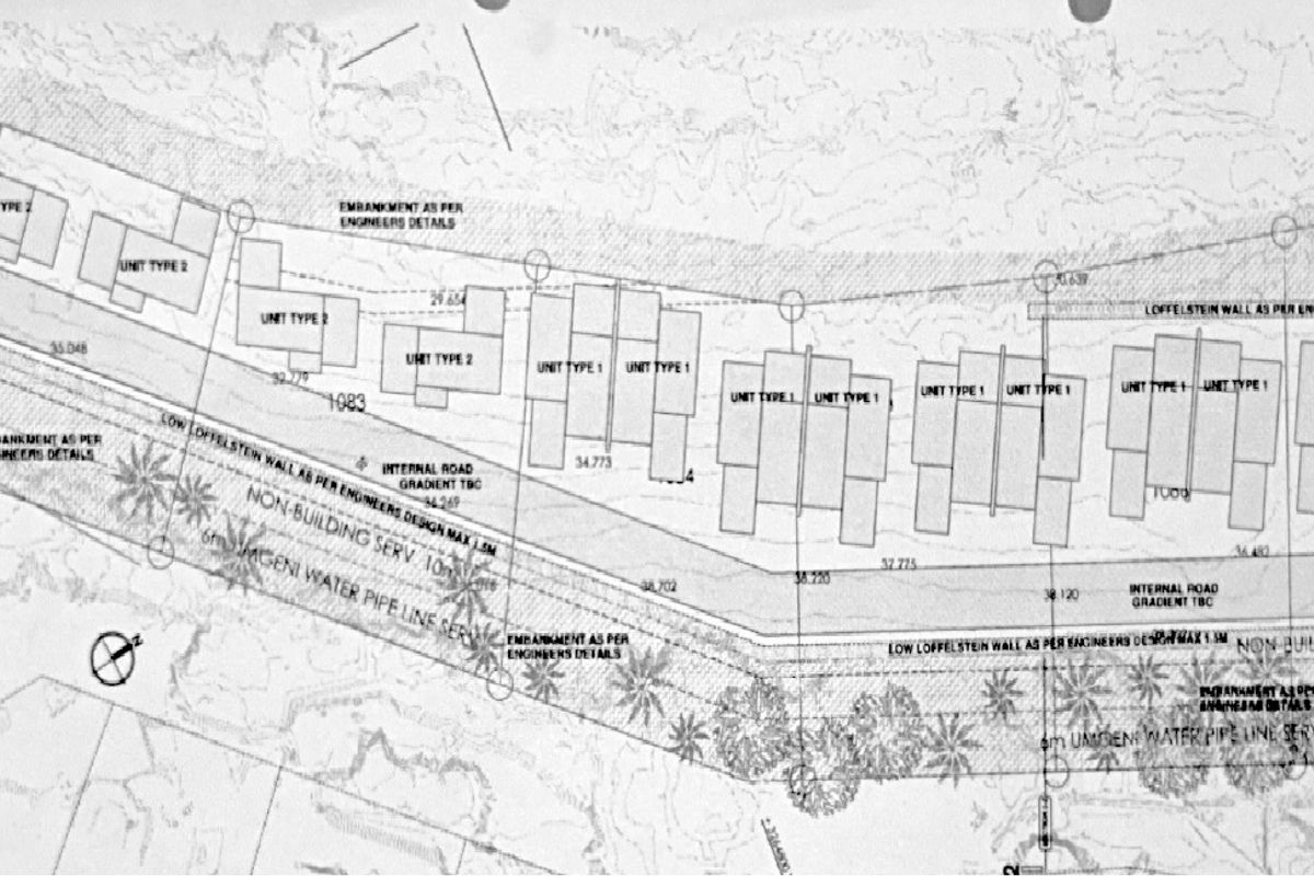 Architectural site plan showing the proposed layout of residential units, internal roads, and infrastructure servitudes on the property.