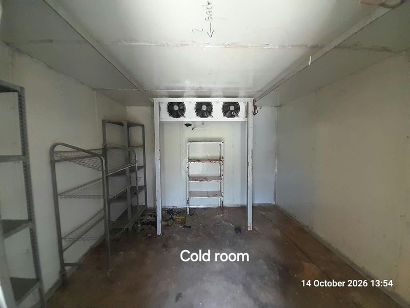 A dedicated cold room facility featuring industrial refrigeration equipment and insulated paneling, suitable for agricultural or commercial storage requirements.
