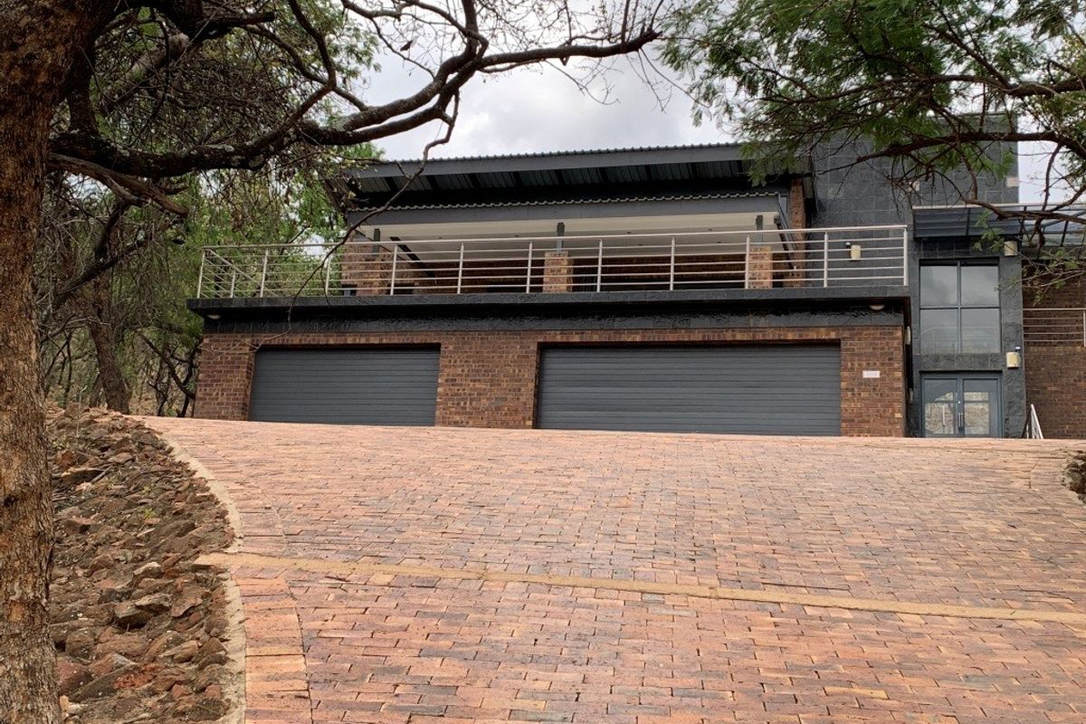 Architectural Masterpiece with Breathtaking Bushveld Views - Photo 2