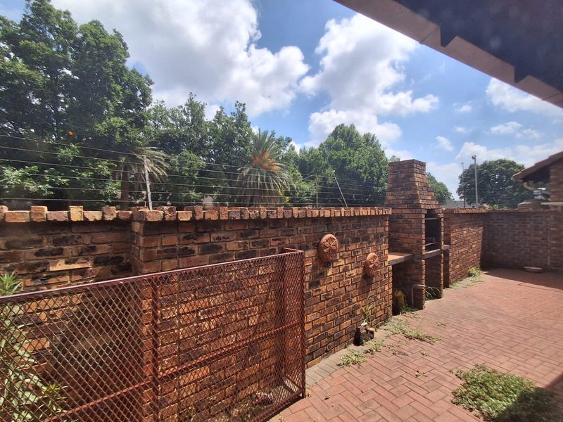 Situated in this peaceful and well kept complex in Arcon Park is this Face brick Townhouse. - Photo 5