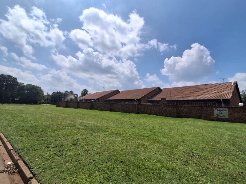 Situated in this peaceful and well kept complex in Arcon Park is this Face brick Townhouse. - Photo 3