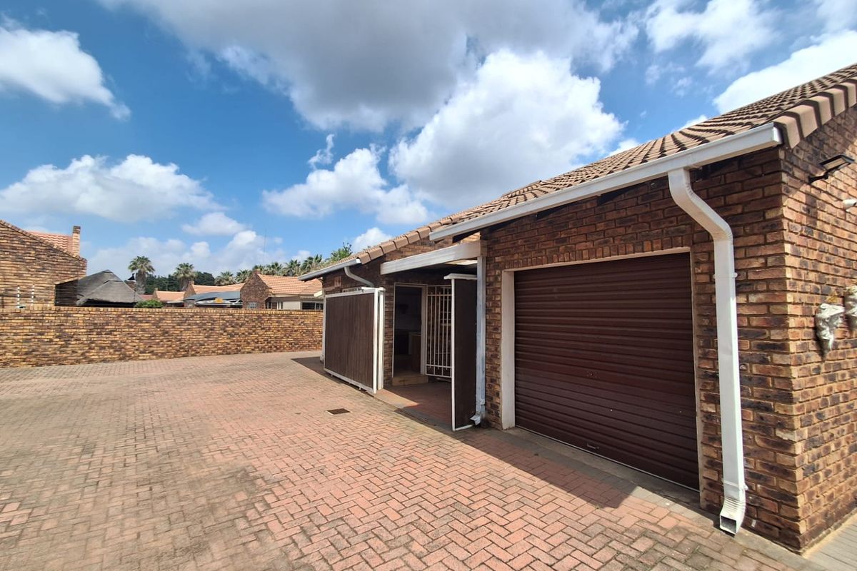 Situated in this peaceful and well kept complex in Arcon Park is this Face brick Townhouse. - Photo 4