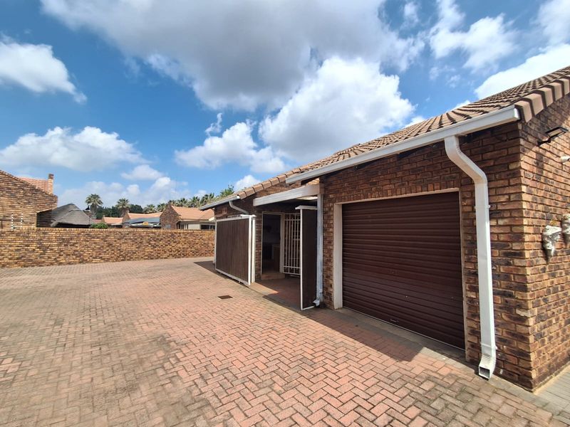 Situated in this peaceful and well kept complex in Arcon Park is this Face brick Townhouse. - Photo 4