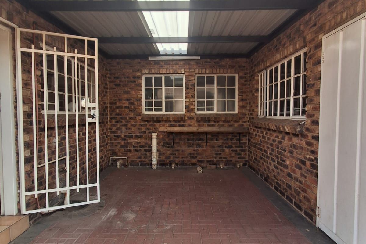 Situated in this peaceful and well kept complex in Arcon Park is this Face brick Townhouse. - Photo 2