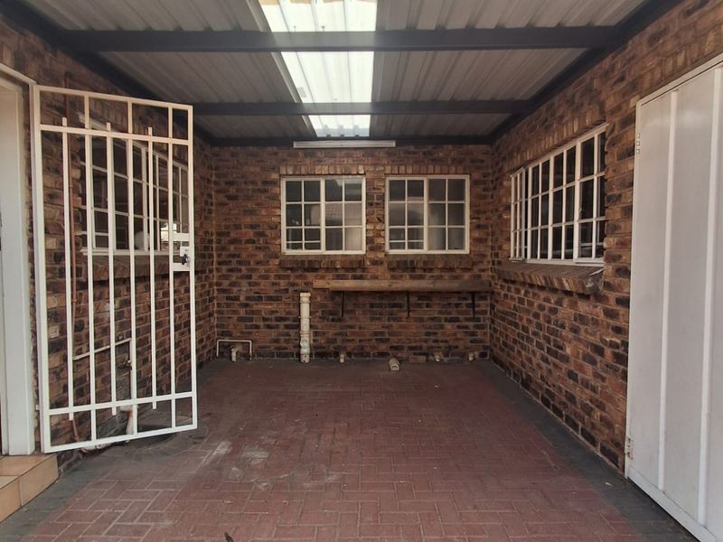 Situated in this peaceful and well kept complex in Arcon Park is this Face brick Townhouse. - Photo 2