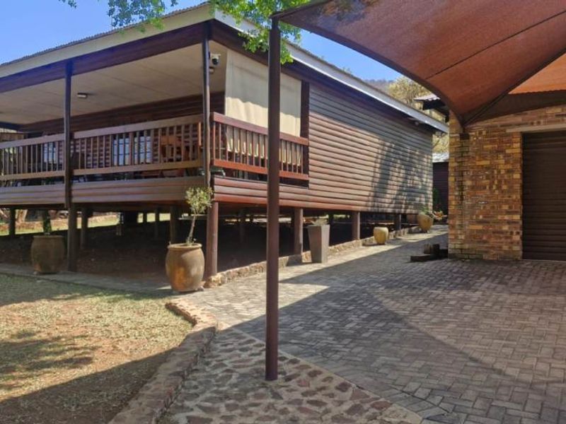 Charming Bushveld Retreat with Veranda & Exceptional Outdoor Living - Photo 7