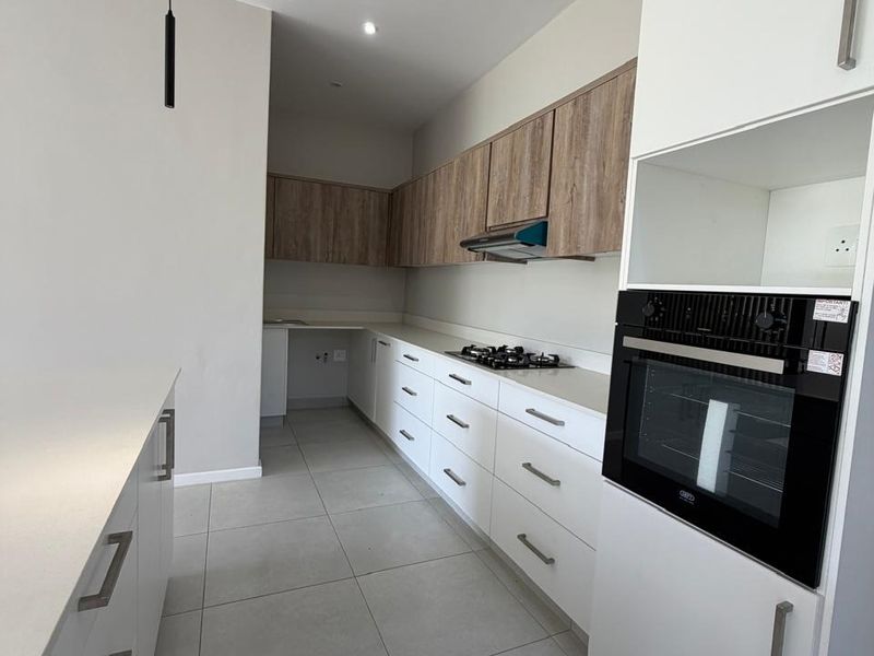 Modern Four-Bedroom Home in Exclusive Palm Lakes Development - Photo 10