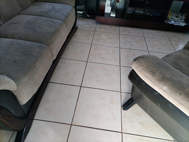 A view of a living room area featuring ceramic floor tiles.