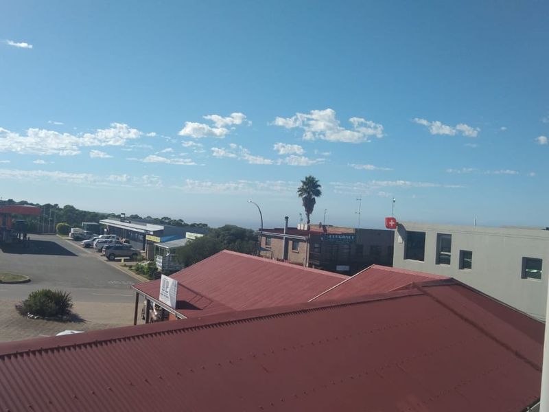 An elevated view overlooking the surrounding neighbourhood, rooftops, and local street infrastructure.