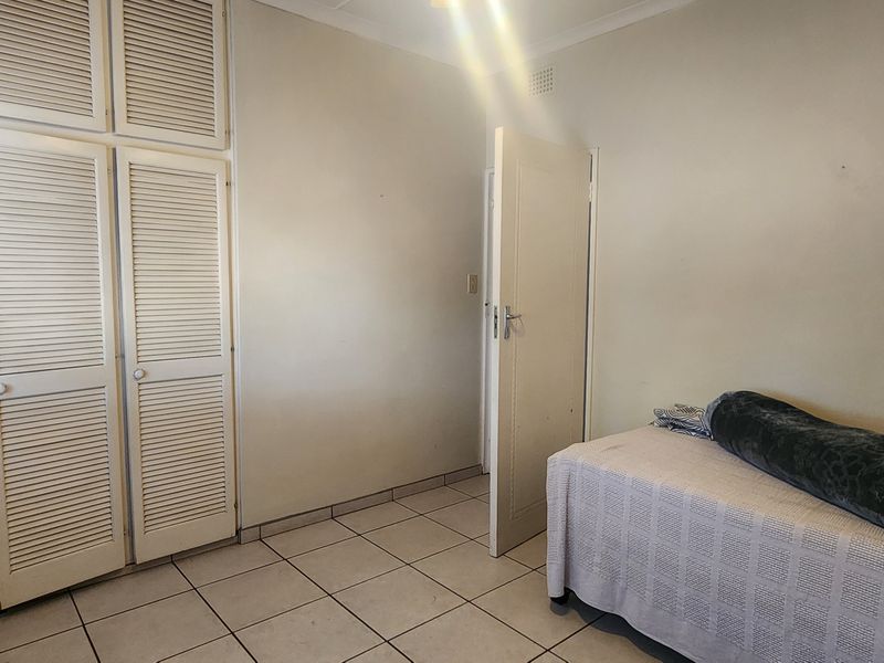Spacious Three-Bedroom Home with Modern Entertainment Area - Photo 8