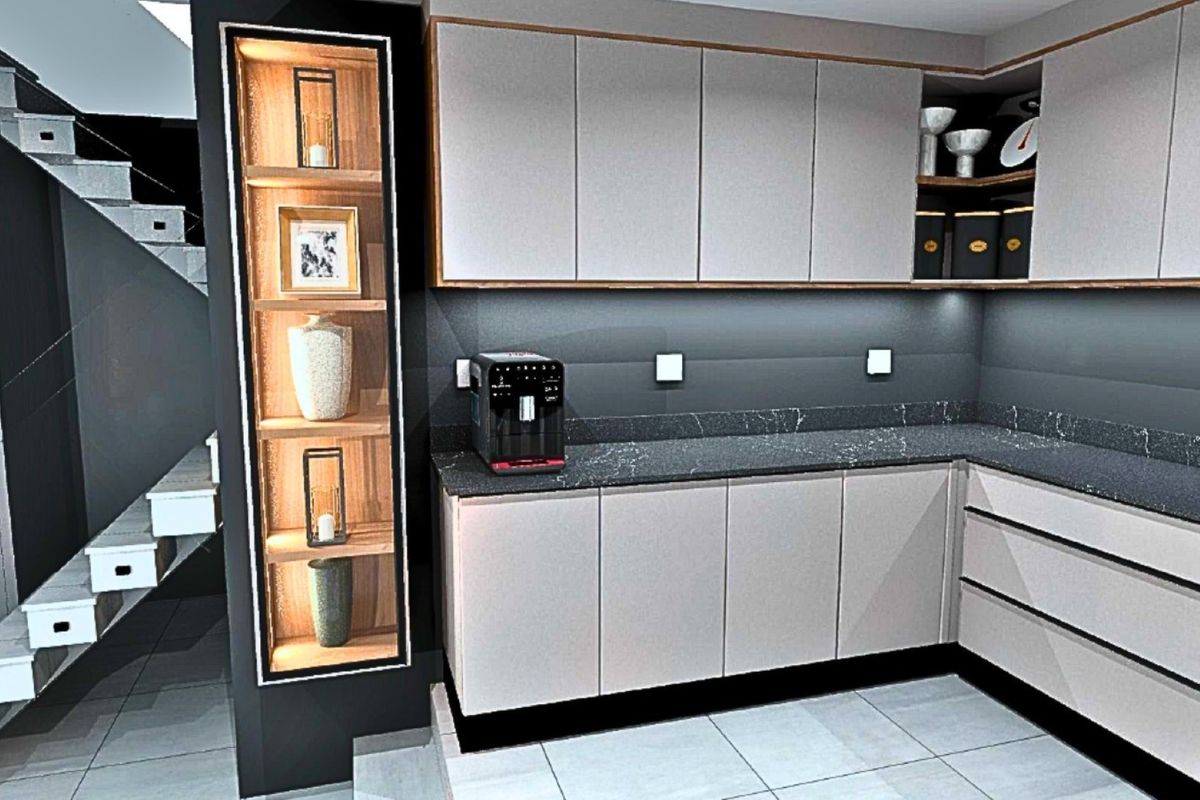 Modern kitchen featuring sleek cabinetry, dark stone countertops, integrated shelving with accent lighting, and a contemporary staircase adjacent to the workspace.