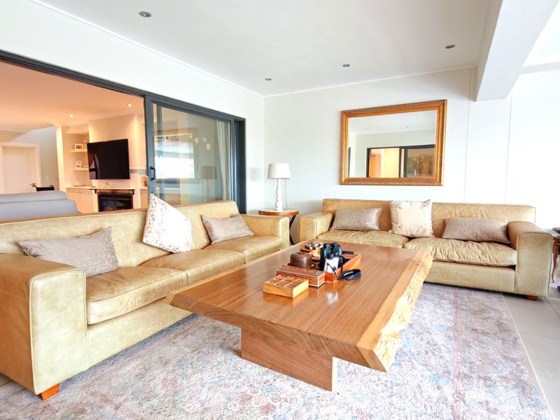 A bright and spacious living area featuring large sliding glass doors that provide seamless access to the interior living space.