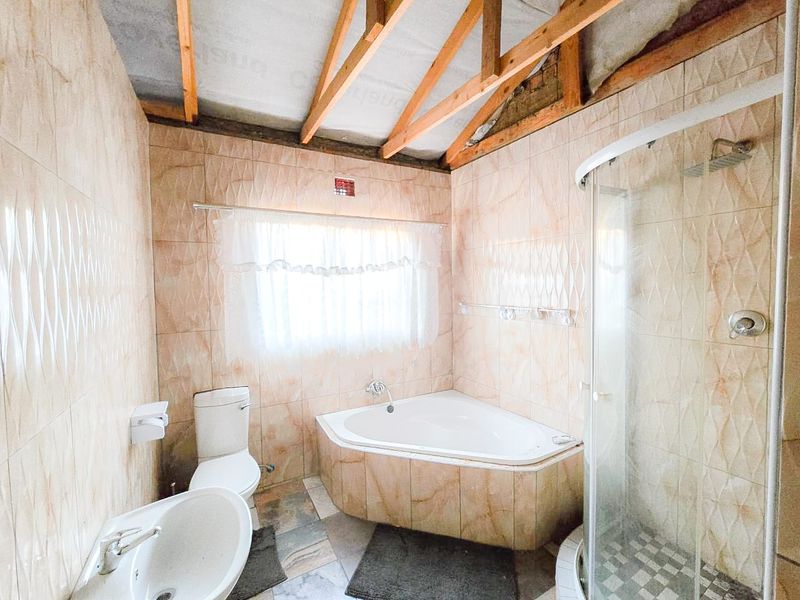 Spacious 4-Bedroom Home with Additional Outside Rooms for Versatile Living - Photo 6