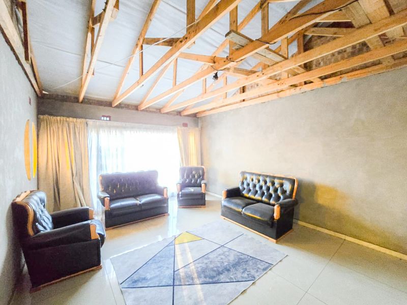 Spacious 4-Bedroom Home with Additional Outside Rooms for Versatile Living - Photo 4