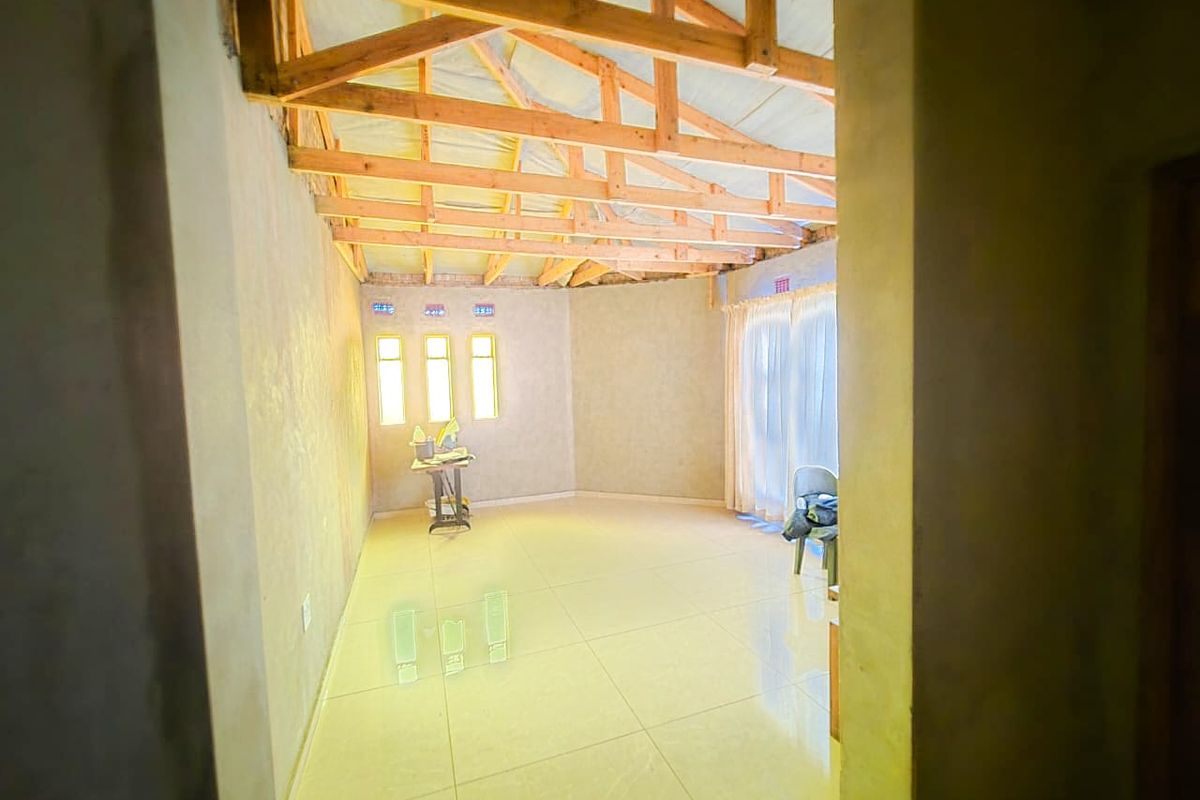 Spacious 4-Bedroom Home with Additional Outside Rooms for Versatile Living - Photo 3