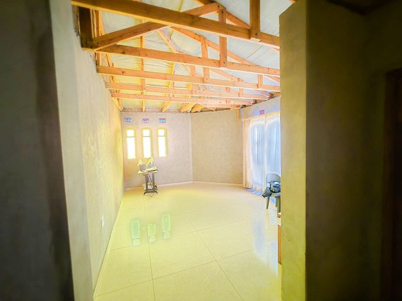 Spacious 4-Bedroom Home with Additional Outside Rooms for Versatile Living - Photo 3