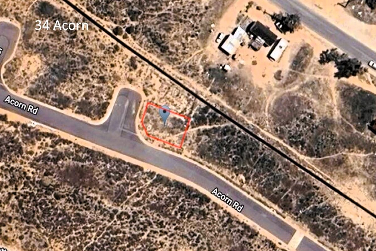 Aerial view of a vacant residential plot located at 34 Acorn, showing the property boundaries and surrounding street layout.