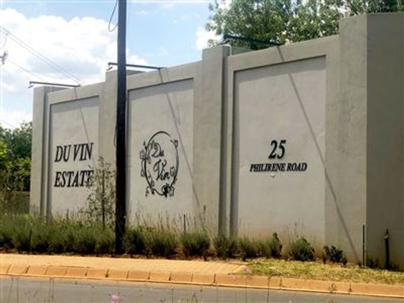 A view of the perimeter wall and entrance signage for Du Vin Estate, located at 25 Philirene Road.