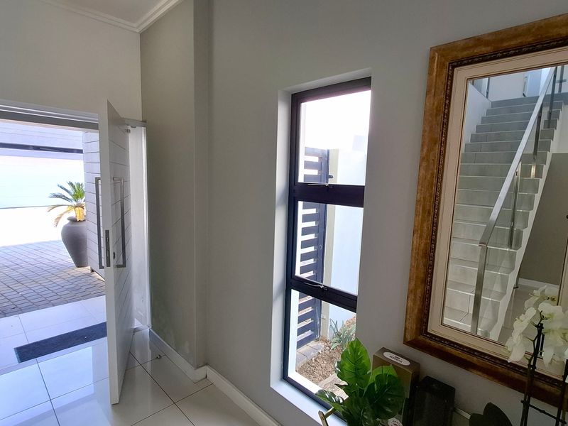 Tucked away in a secure estate, this modern duplex townhouse has room for the whole family. - Photo 2