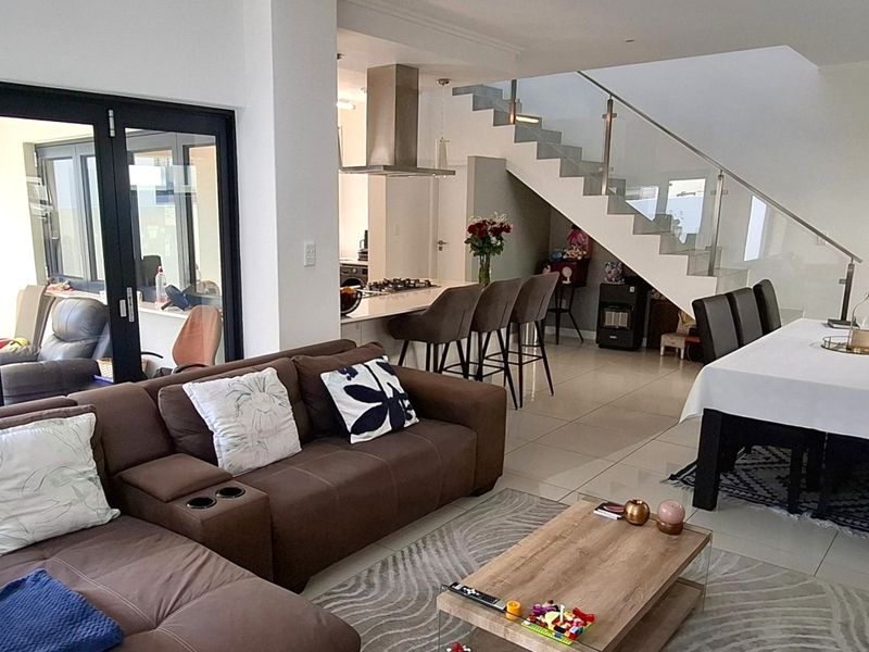 Tucked away in a secure estate, this modern duplex townhouse has room for the whole family. - Photo 3