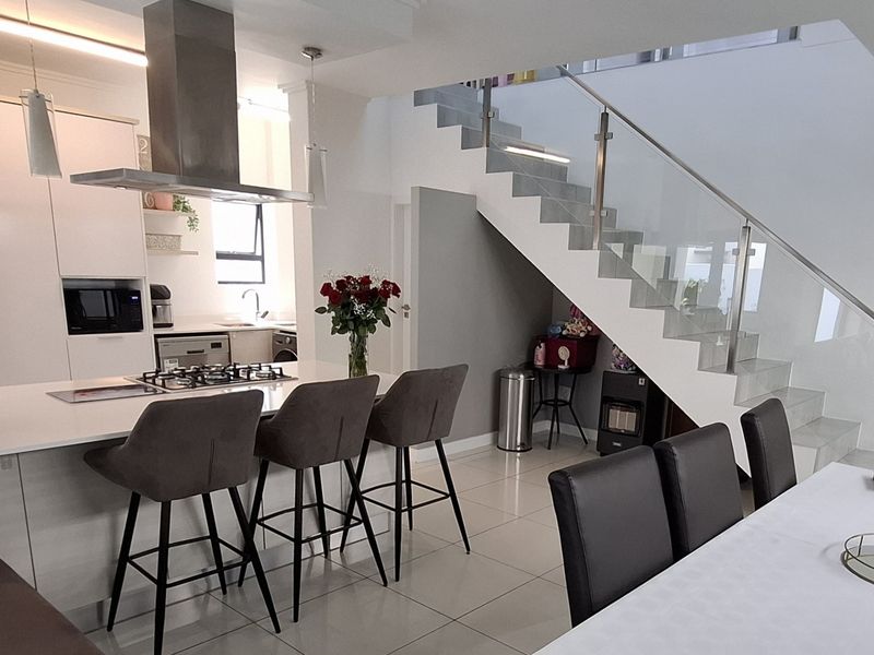 Tucked away in a secure estate, this modern duplex townhouse has room for the whole family. - Photo 4