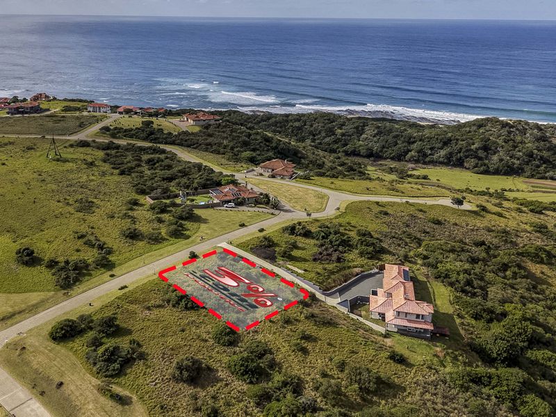 Aerial view of a vacant residential plot situated in a coastal estate, featuring proximity to the ocean and established road infrastructure.