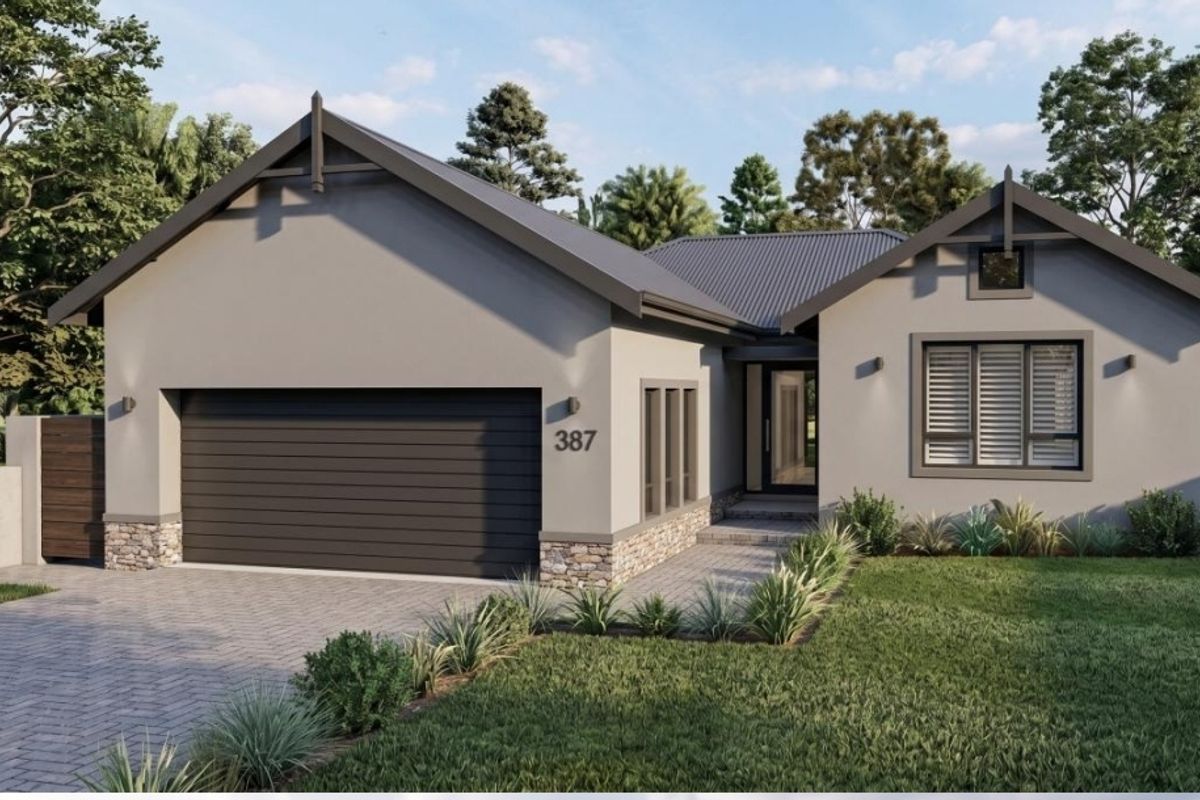 Modern single-story residential home featuring a double garage, stone-accented facade, paved driveway, and contemporary architectural styling.