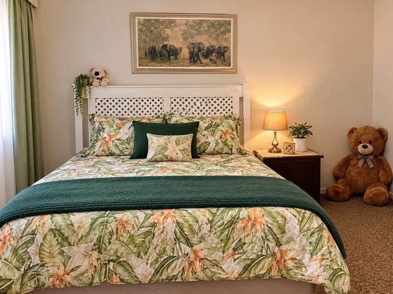 A well-maintained bedroom featuring neutral wall tones, carpeted flooring, and decorative coving, providing a comfortable and inviting sleeping space.